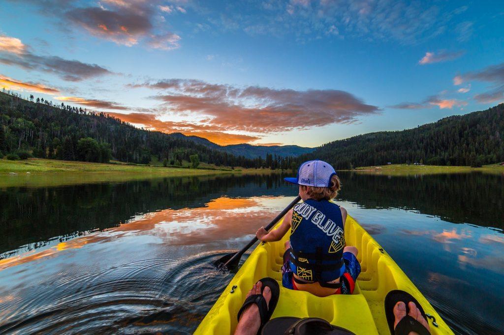 kid kayaking on water What to do in Durango Colorado Visit USA Parks