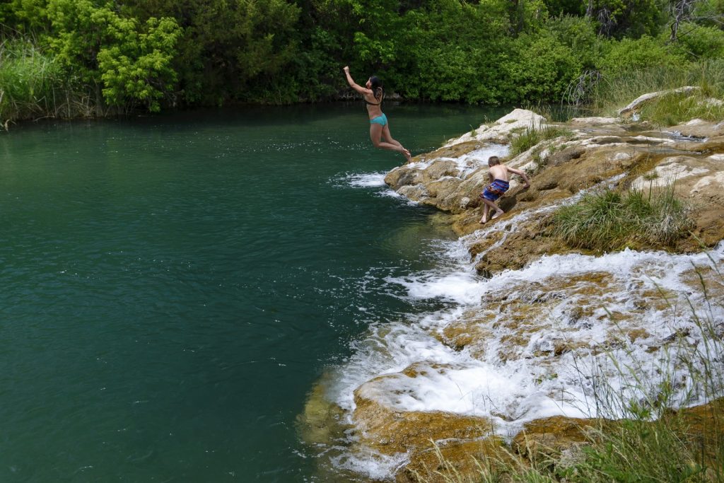jumping into the water at Cascade Falls