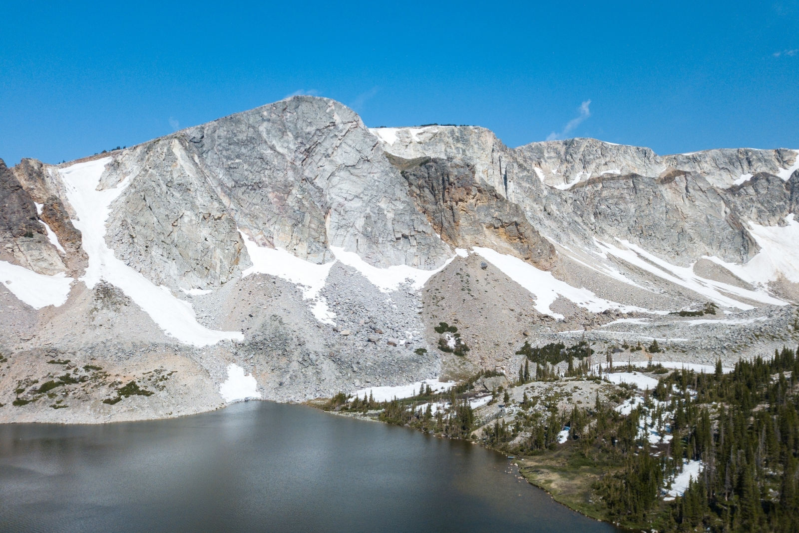 Alpine lake with mountain in the background.