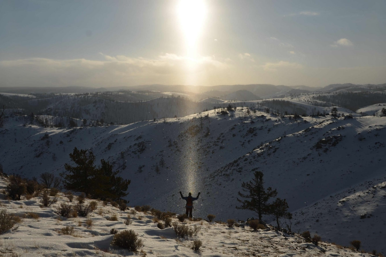 person in winter in the sunshine in snow in Carbon County, Wyoming