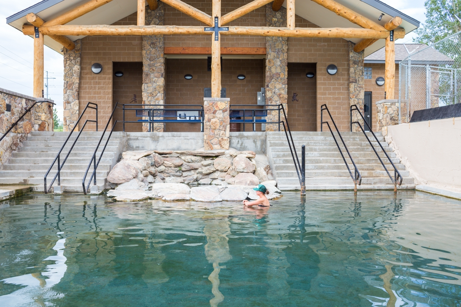 woman wading in hot springs