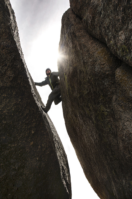 man crack climbing in Laramie in the summer