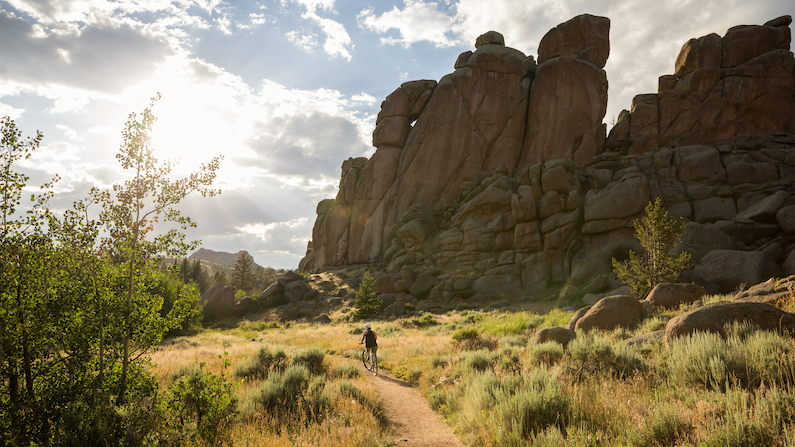 Mountain biker on trail near Laramie, Wyoming in the summer