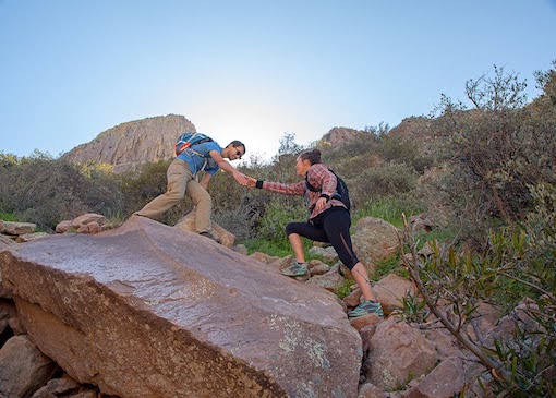 Two people hiking Siphon Draw Trail in Lost Dutchman State Park, Arizona