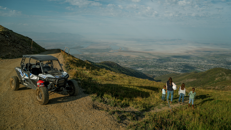 Family enjoying view from top of Francis Peak with ATV