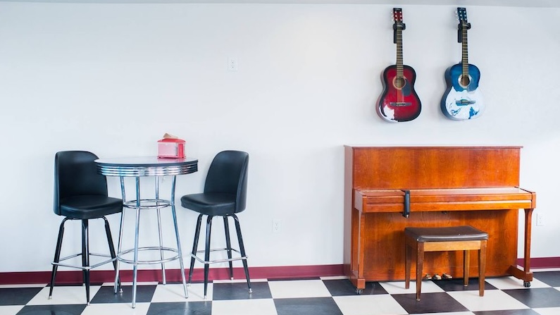 Diner seating with patio and guitars