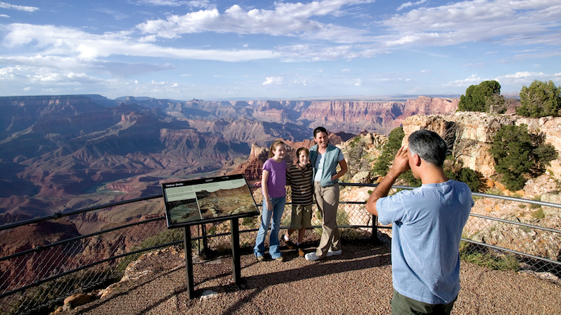 Family taking photos at Grand Canyon in Arizona
