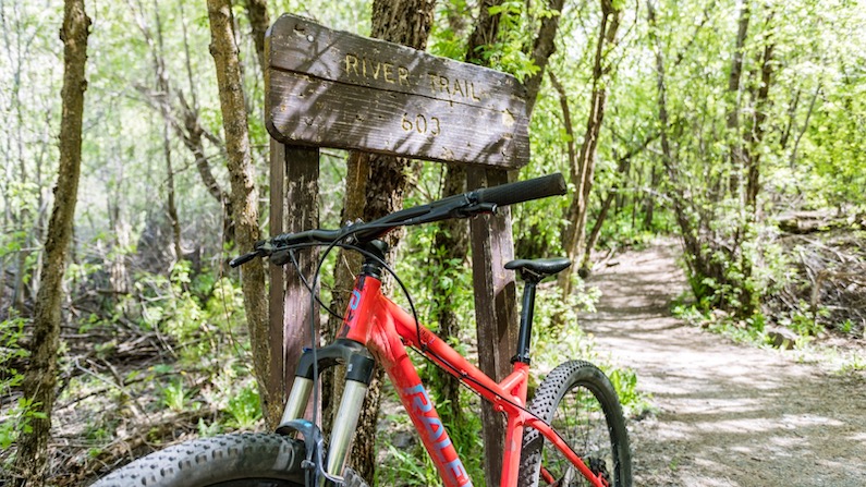 Mountain bike at sign for River Trail in Logan, Utah