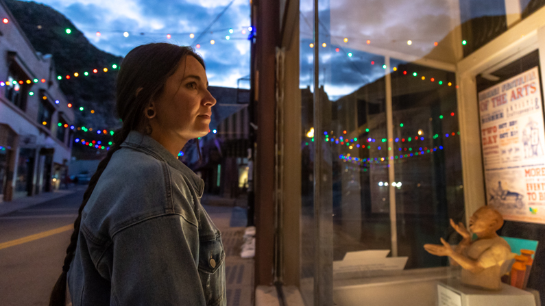 woman looking into store window