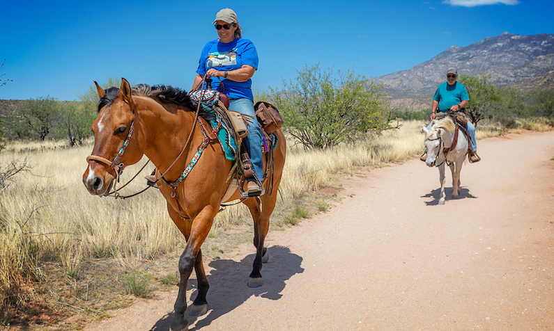 Two riders on horseback in Arizona's Catalina State Park