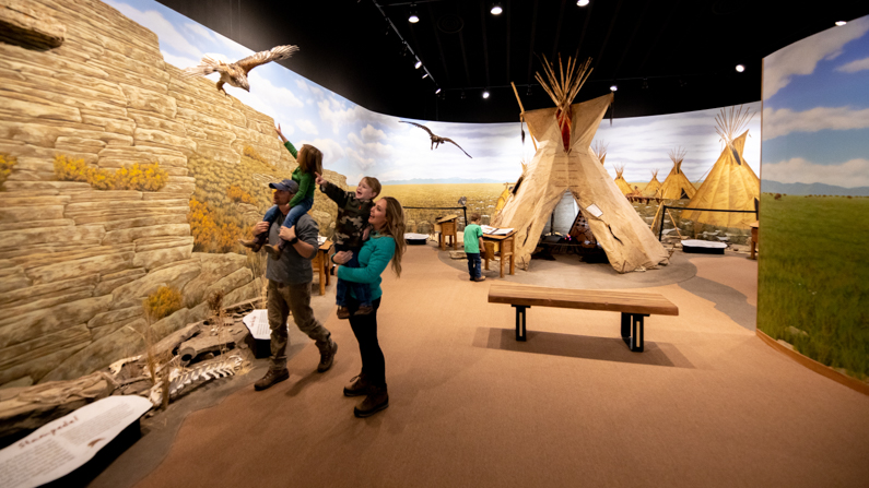 Family in visitor center at First Peoples' Buffalo Jump State Park