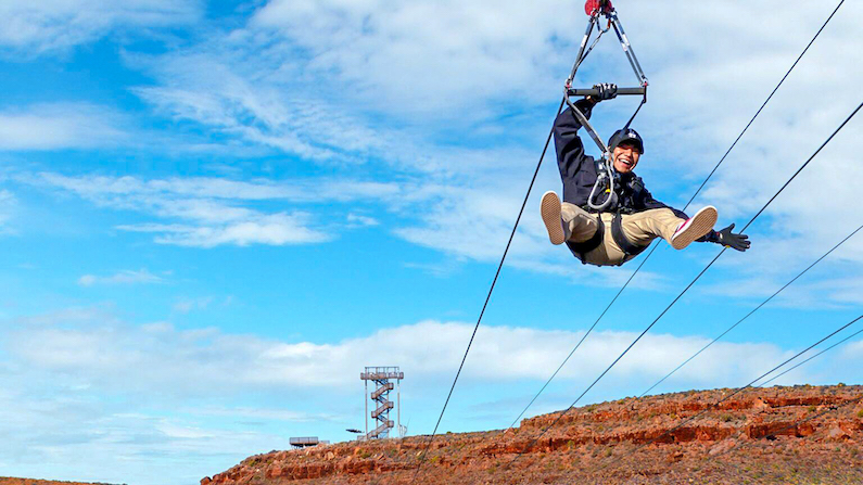 Person ziplining across a canyon in Grand Canyon West