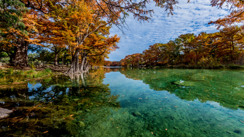Fall foliage at the lake in Garner State Park, Texas