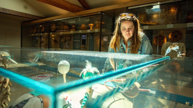 Woman looking into display case at the Museum of Northern Arizona