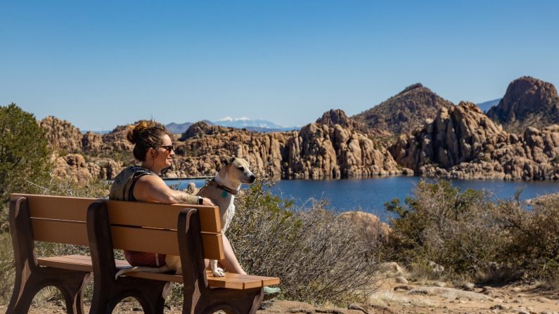 Woman and dog on bench in Prescott, Arizona