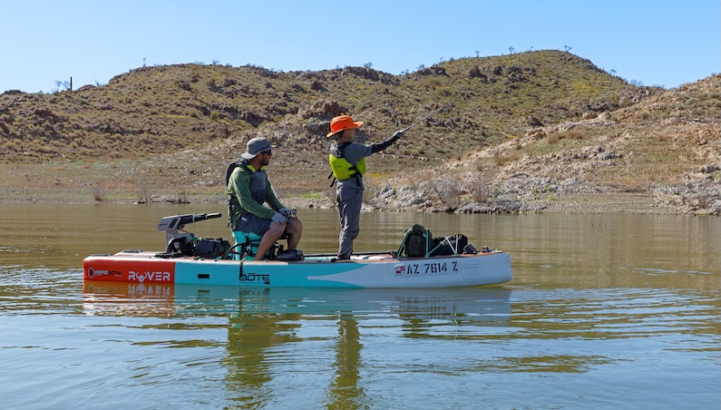 Child and adult on boat fishing in Alamo Lake State Park