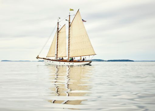 Sailboat in the sea with people on board