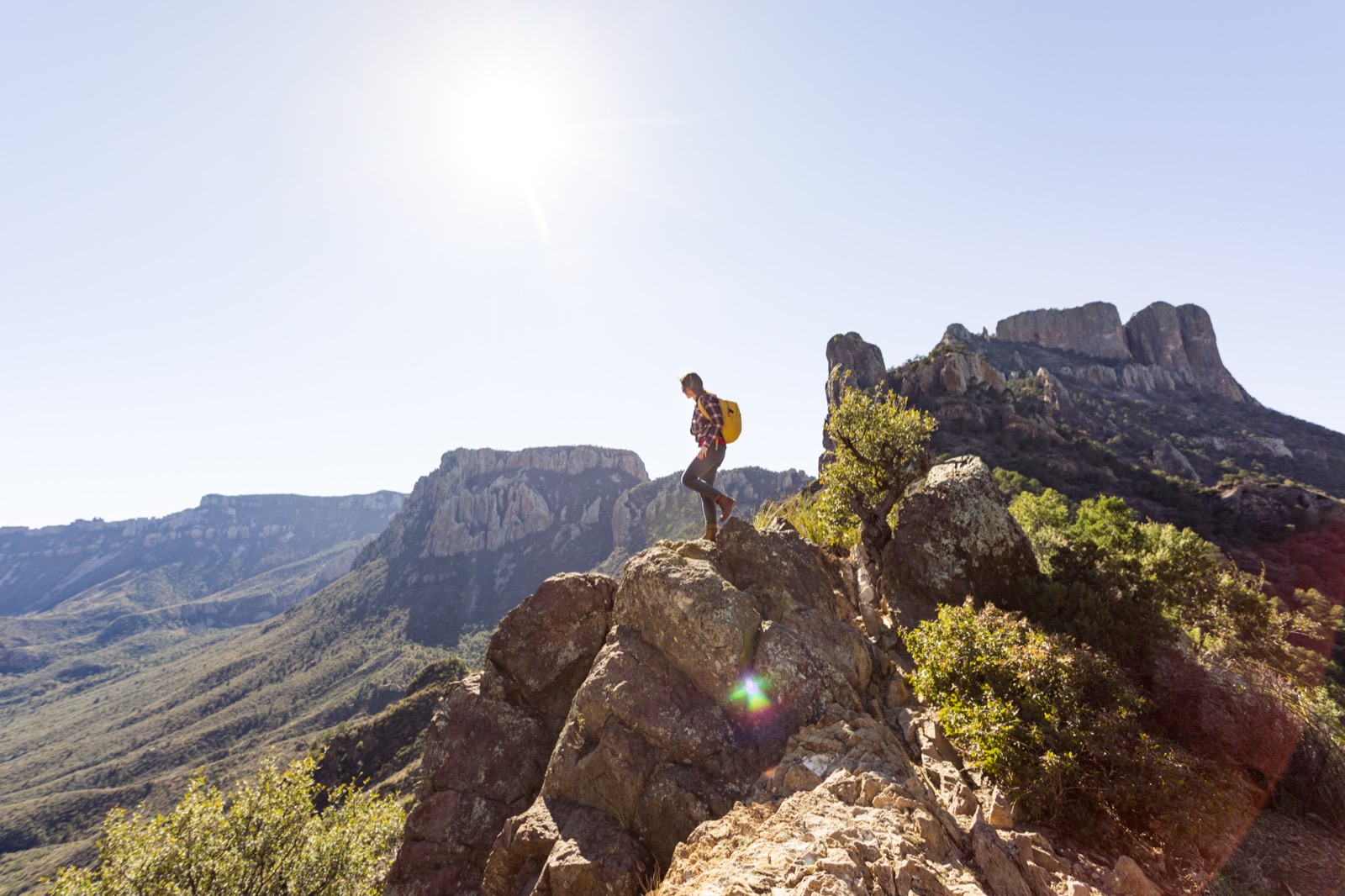 Hiker in Big Bend National Park with mountains in the background